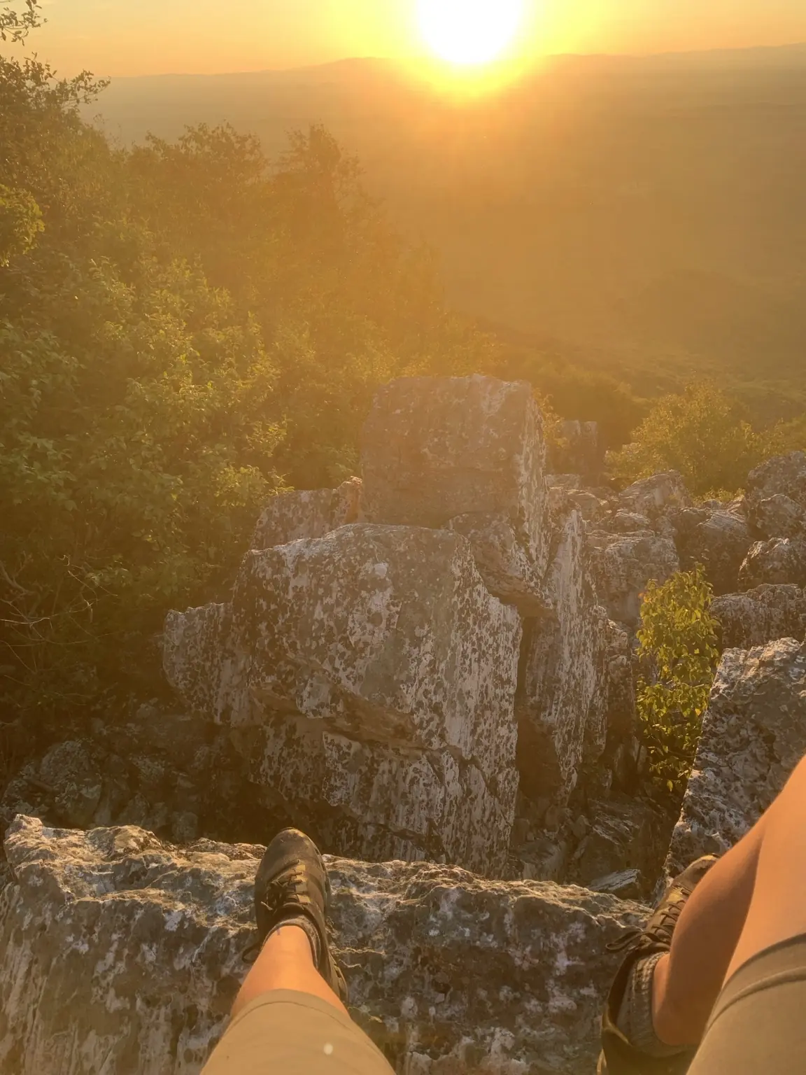 Sunset viewed from a rocky mountain overlook